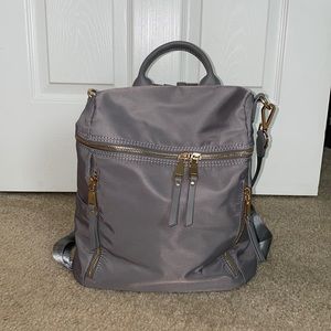 Gray waterproof backpack with gold details